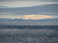 Mount Baker behind layers of clouds and fog