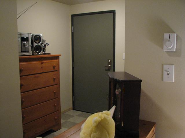 IMG_4765 The view of the front door.  That was really the best place to put the chest of drawers.  Our stereo doesn't get very good reception there, but I guess we didn't listen to the radio much anyway.