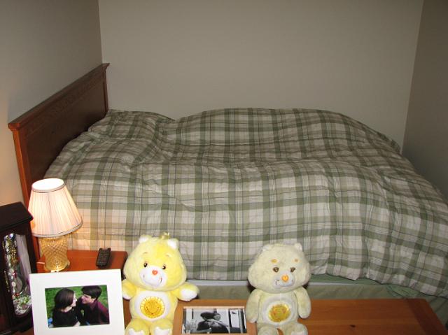 IMG_4797 Our bed, with a nightstand, and dresser in the foreground.