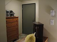 IMG_4765 The view of the front door.  That was really the best place to put the chest of drawers.  Our stereo doesn't get very good reception there, but I guess we didn't listen to the radio much anyway.